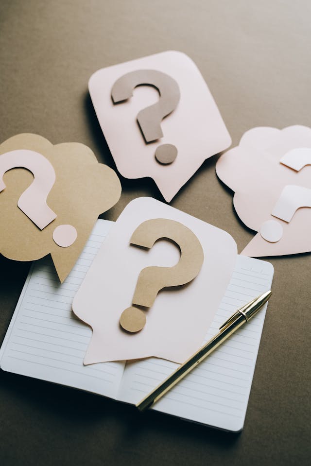 pexels-leeloothefirst-5428824 1 - GeoPlugin - Resources Question marks made out of paper.