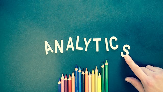 pexels-marketingtuig-185576 - GeoPlugin - Resources The word “Analytics” with pencils underneath.