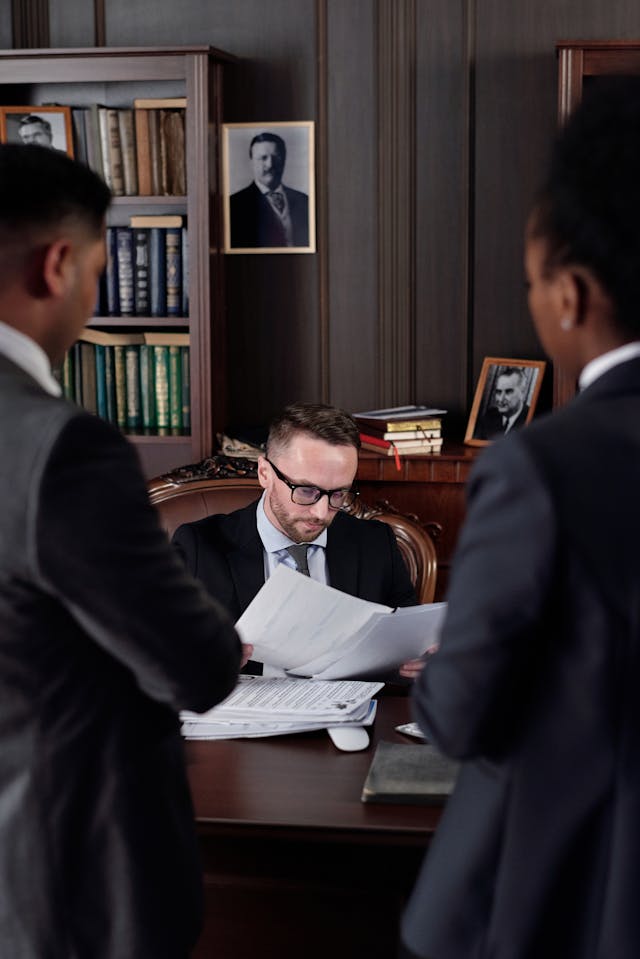pexels-august-de-richelieu-4427428 - GeoPlugin - Resources Lawyers talking in an office.