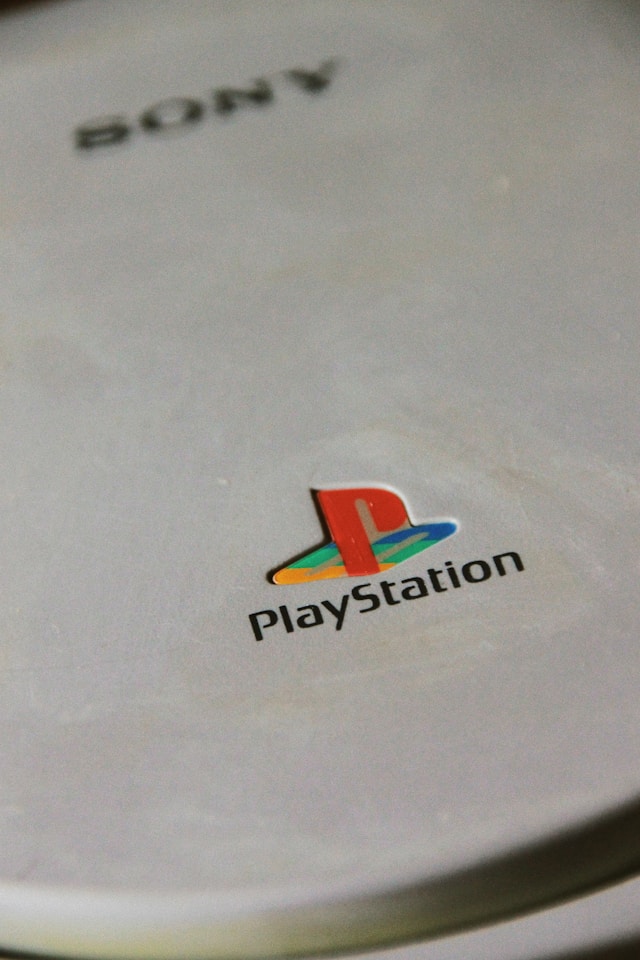 cartist-E6vUIpw7OtA-unsplash - GeoPlugin - Resources The PlayStation logo on a PS1.