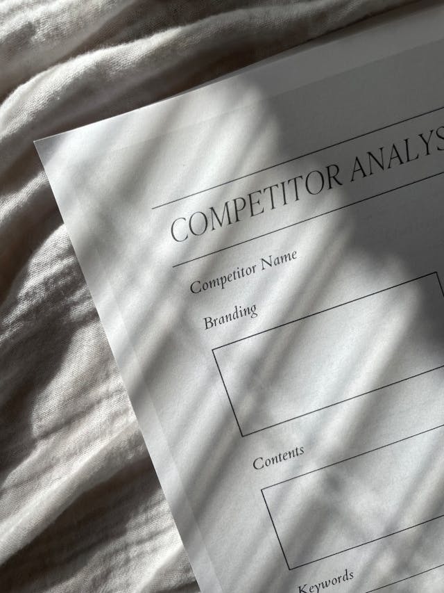 The word “Competitor Analysis” on paper. 