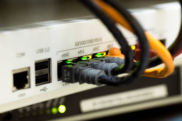 pexels-pixabay-159304 3 - GeoPlugin - Resources Ethernet calves going into a modem.