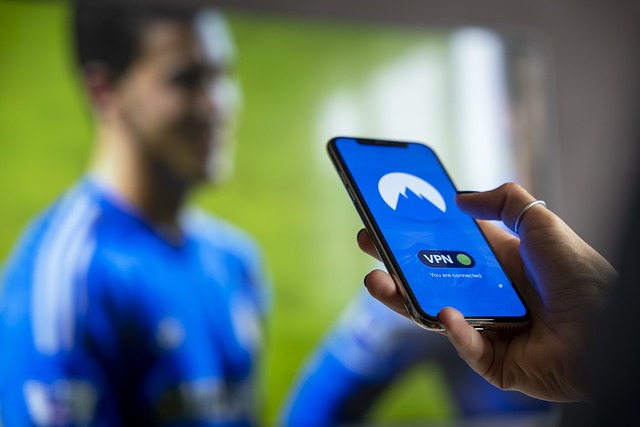 cellphone-5494594_640 - GeoPlugin - Resources Someone holding a mobile phone showing that a VPN is connected.